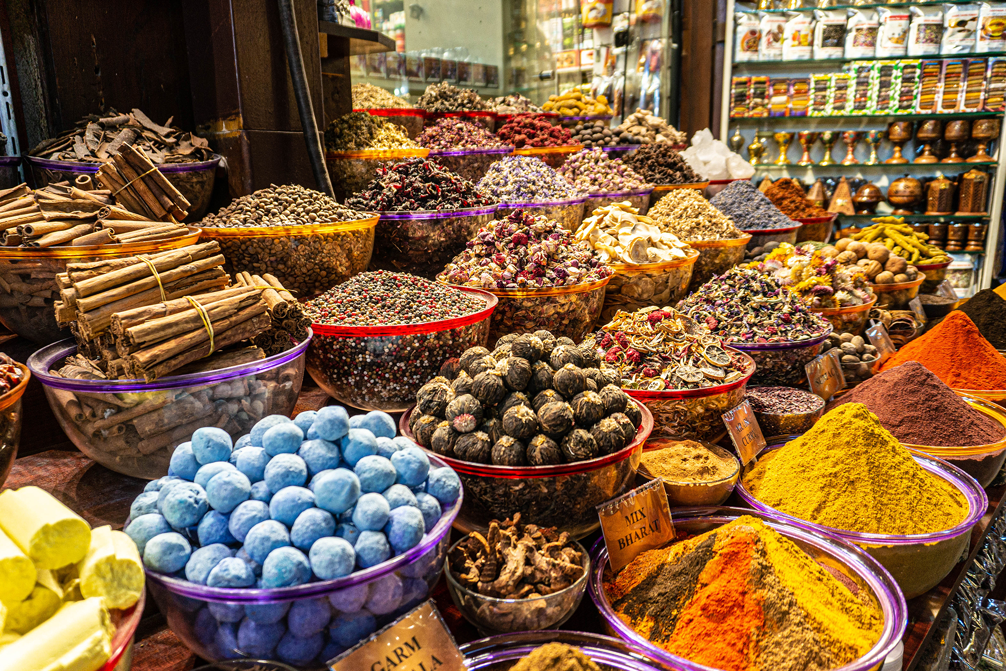 A counter with seasonings and spices in the ancient Arab spice market. A large number of colors and flavors. Dubai.